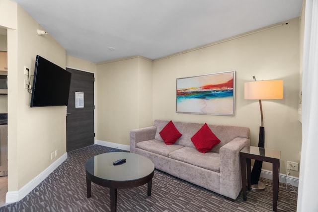 carpeted living room with ornamental molding