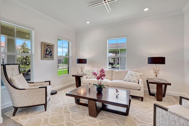 living room featuring a healthy amount of sunlight and crown molding