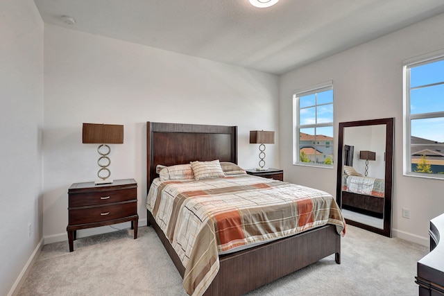 bedroom featuring light carpet