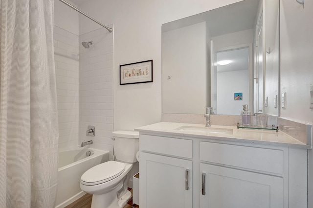 full bathroom featuring toilet, hardwood / wood-style floors, vanity, and shower / tub combo with curtain