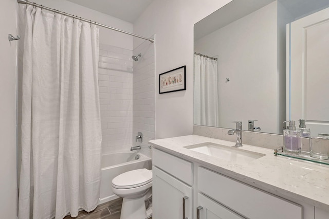 full bathroom featuring toilet, vanity, and shower / bathtub combination with curtain