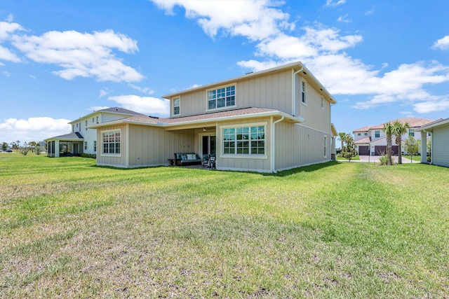 rear view of house with a lawn