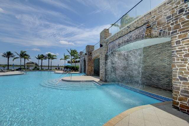 view of pool featuring pool water feature