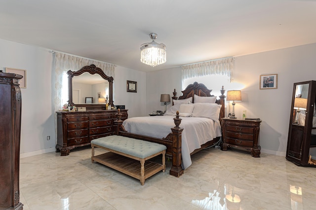 bedroom featuring an inviting chandelier