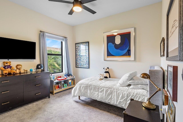 bedroom with ceiling fan and carpet flooring