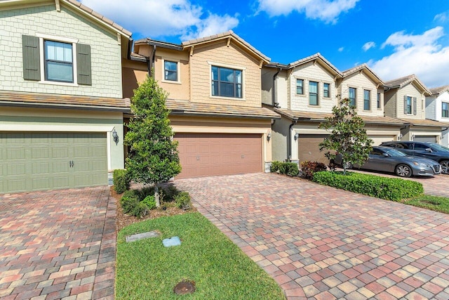 townhome / multi-family property featuring a garage