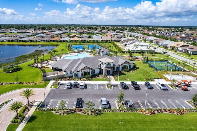 birds eye view of property with a water view