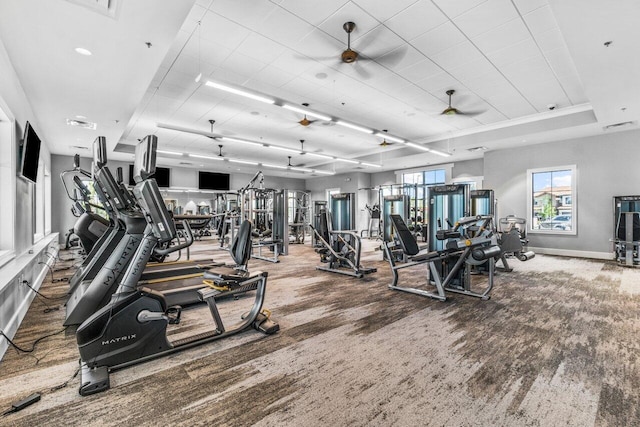 gym with ceiling fan and carpet flooring