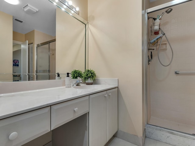 bathroom with an enclosed shower and vanity