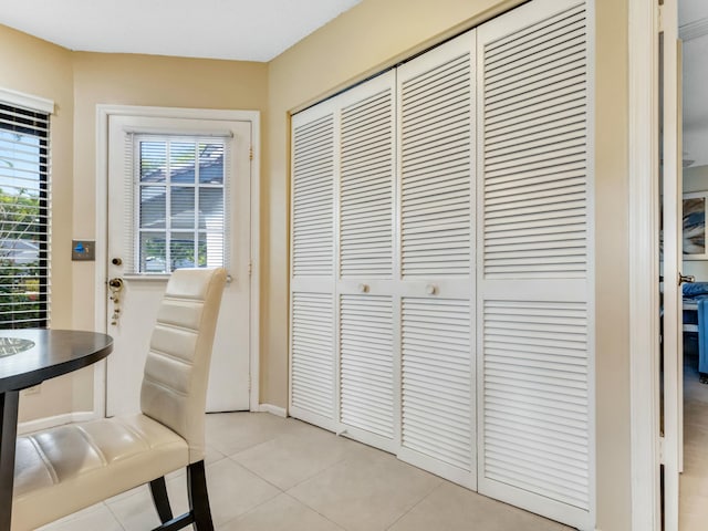 doorway to outside featuring light tile patterned floors