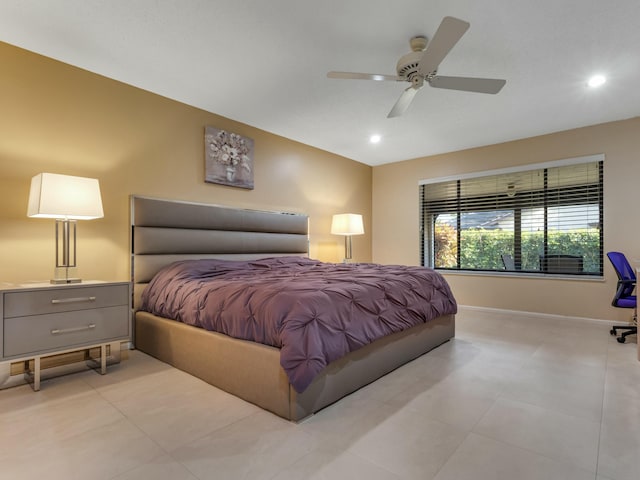 tiled bedroom featuring ceiling fan