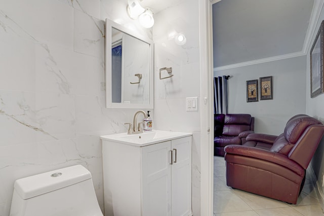 bathroom with tile walls, ornamental molding, toilet, tile patterned floors, and vanity