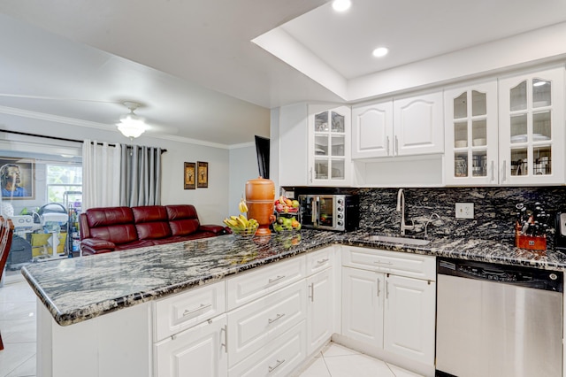 kitchen with sink, white cabinets, dishwasher, dark stone countertops, and kitchen peninsula