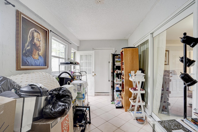 interior space with french doors, a textured ceiling, and light tile patterned floors