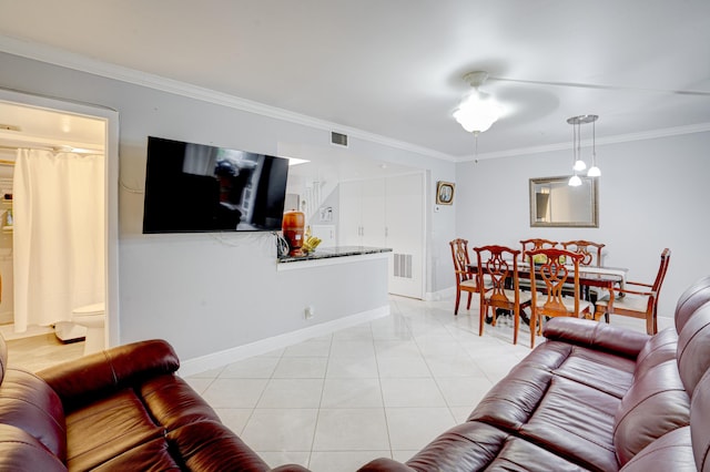 living room featuring light tile patterned flooring, ornamental molding, and ceiling fan