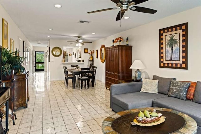 tiled living room featuring ceiling fan