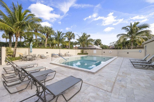 view of swimming pool featuring a patio area