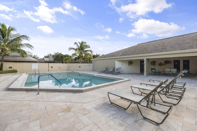 view of swimming pool featuring a patio