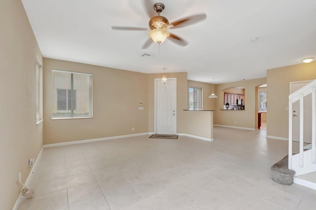 unfurnished room with ceiling fan