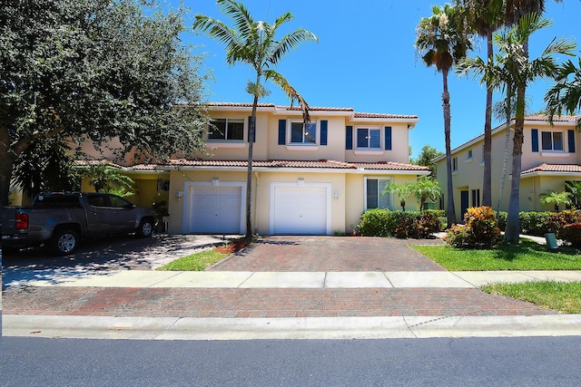 mediterranean / spanish-style home featuring a garage