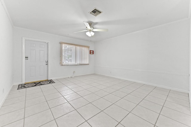 empty room featuring ceiling fan, visible vents, and baseboards