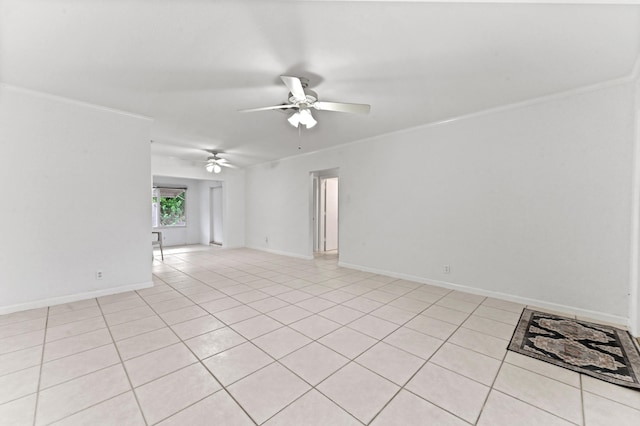 unfurnished room featuring ornamental molding, ceiling fan, and baseboards