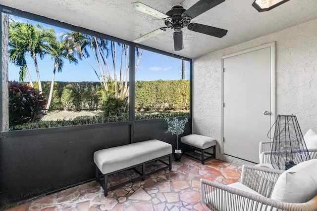 sunroom / solarium with ceiling fan