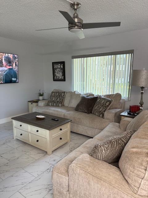 living room with a textured ceiling