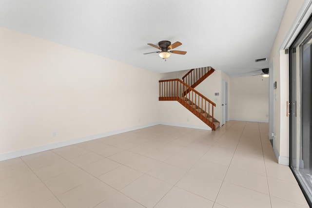 interior space with ceiling fan