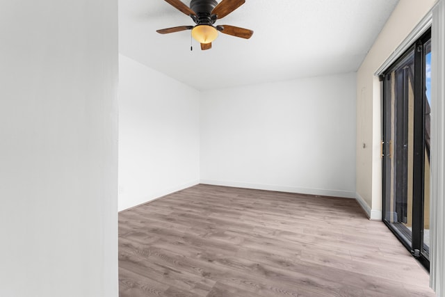 unfurnished room with ceiling fan and light hardwood / wood-style floors