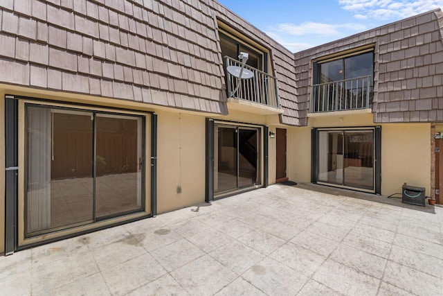 rear view of house featuring a patio area