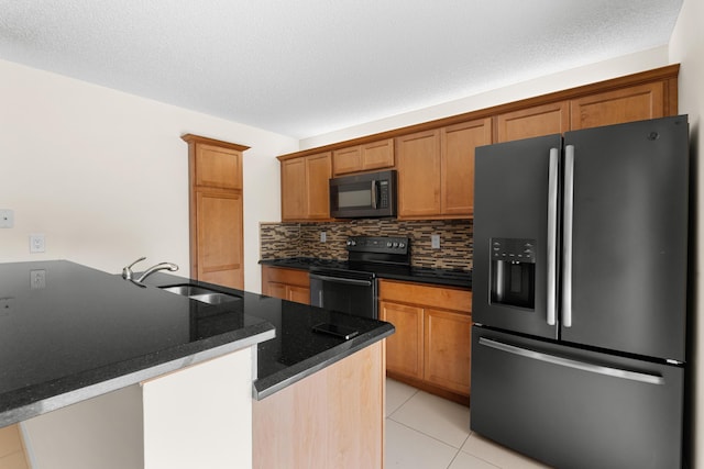 kitchen with black appliances, sink, decorative backsplash, a textured ceiling, and light tile patterned flooring