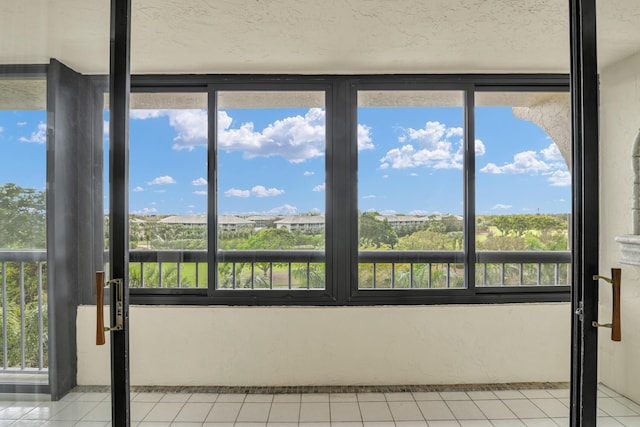 unfurnished sunroom with a healthy amount of sunlight