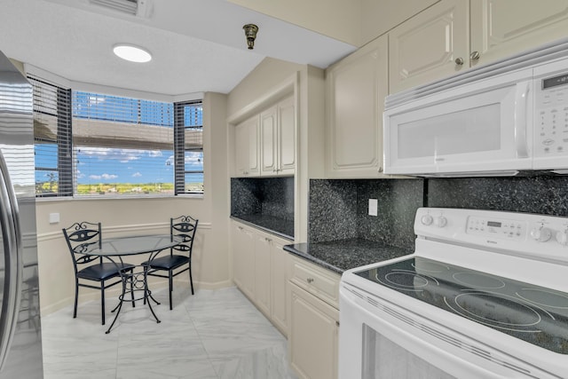 kitchen featuring decorative backsplash and white appliances