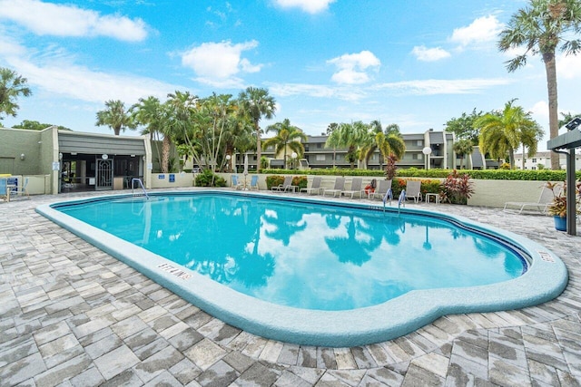 view of swimming pool featuring a patio area