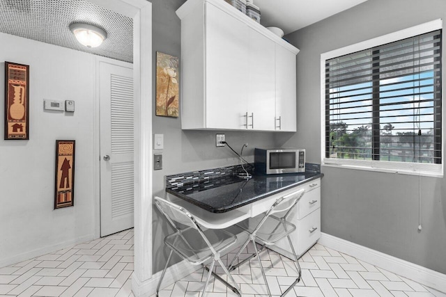 kitchen with white cabinetry