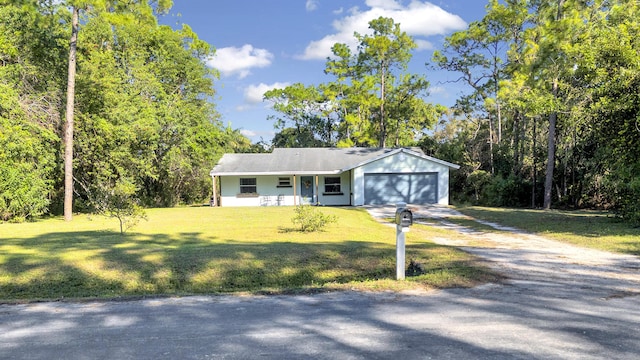 view of front of property with a garage, a front lawn, and a porch