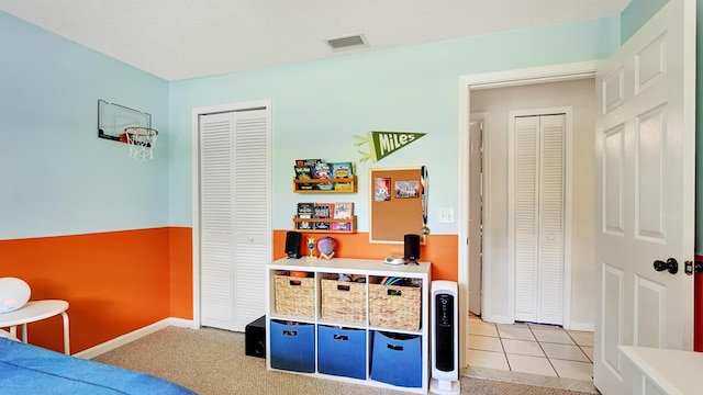 bedroom featuring light colored carpet