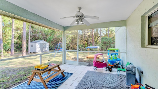 sunroom with ceiling fan and a wealth of natural light