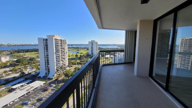 balcony featuring a water view