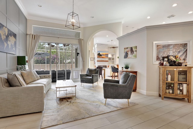 living area featuring recessed lighting, a ceiling fan, baseboards, visible vents, and crown molding