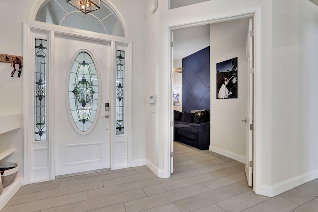 entryway featuring wood finish floors and baseboards