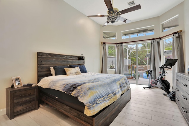 bedroom with access to exterior, ceiling fan, visible vents, and light wood finished floors