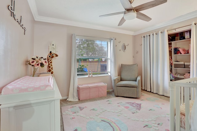 bedroom featuring ornamental molding, light carpet, baseboards, and a ceiling fan