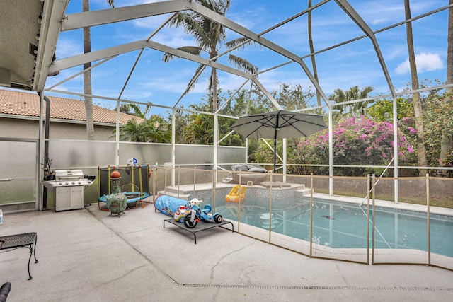 view of swimming pool featuring a patio and a lanai