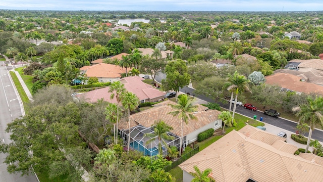 birds eye view of property with a residential view and a water view