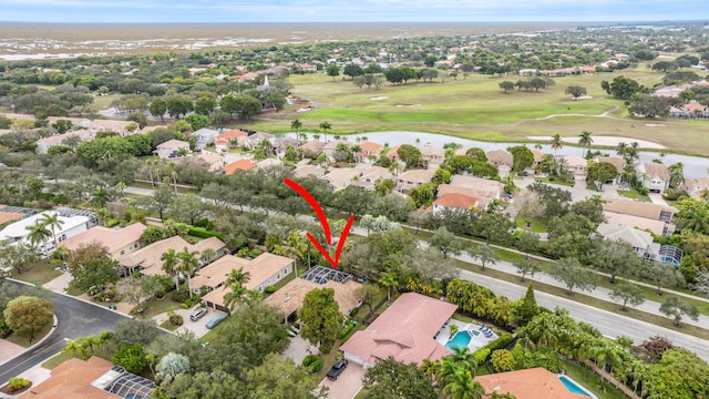 aerial view with a residential view and view of golf course