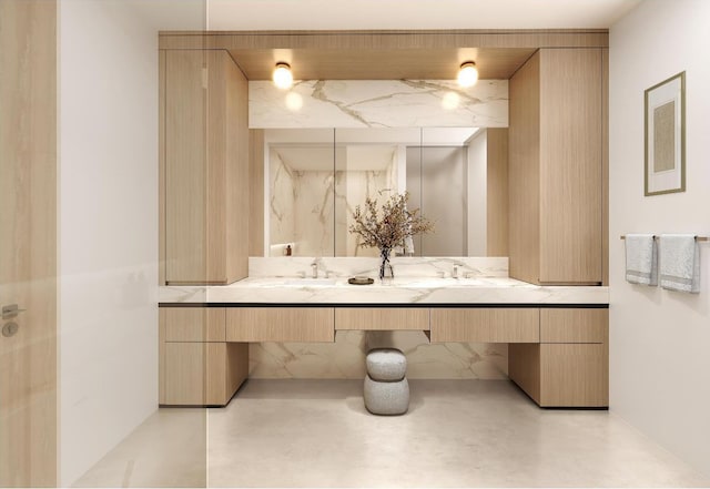 bathroom featuring concrete flooring and vanity