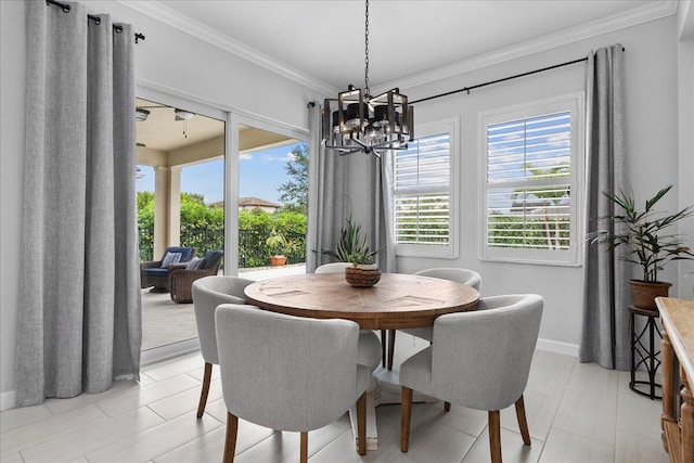 dining area with a notable chandelier and ornamental molding