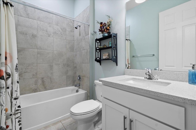 full bathroom featuring vanity, shower / tub combo with curtain, tile patterned floors, and toilet